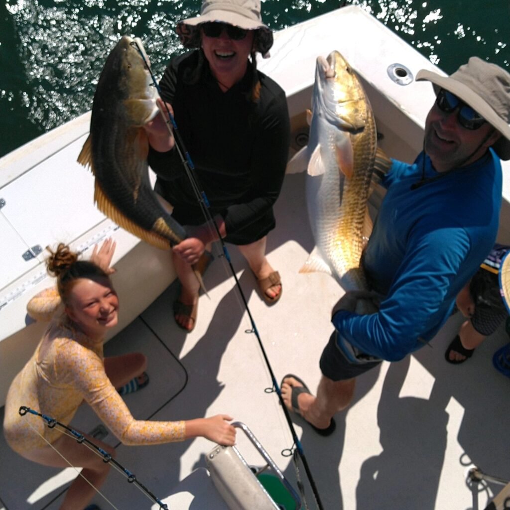 Family having fun catching fish on Sea Teaser